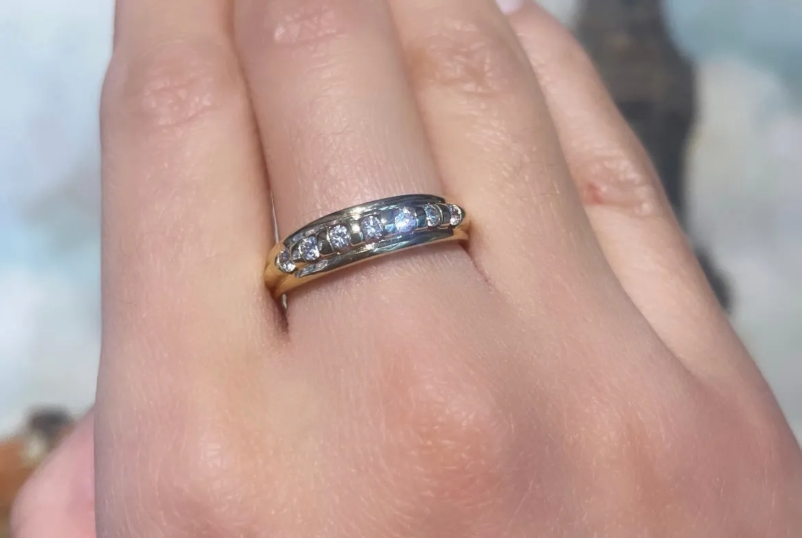 18 carat gold band with brilliant cut diamonds